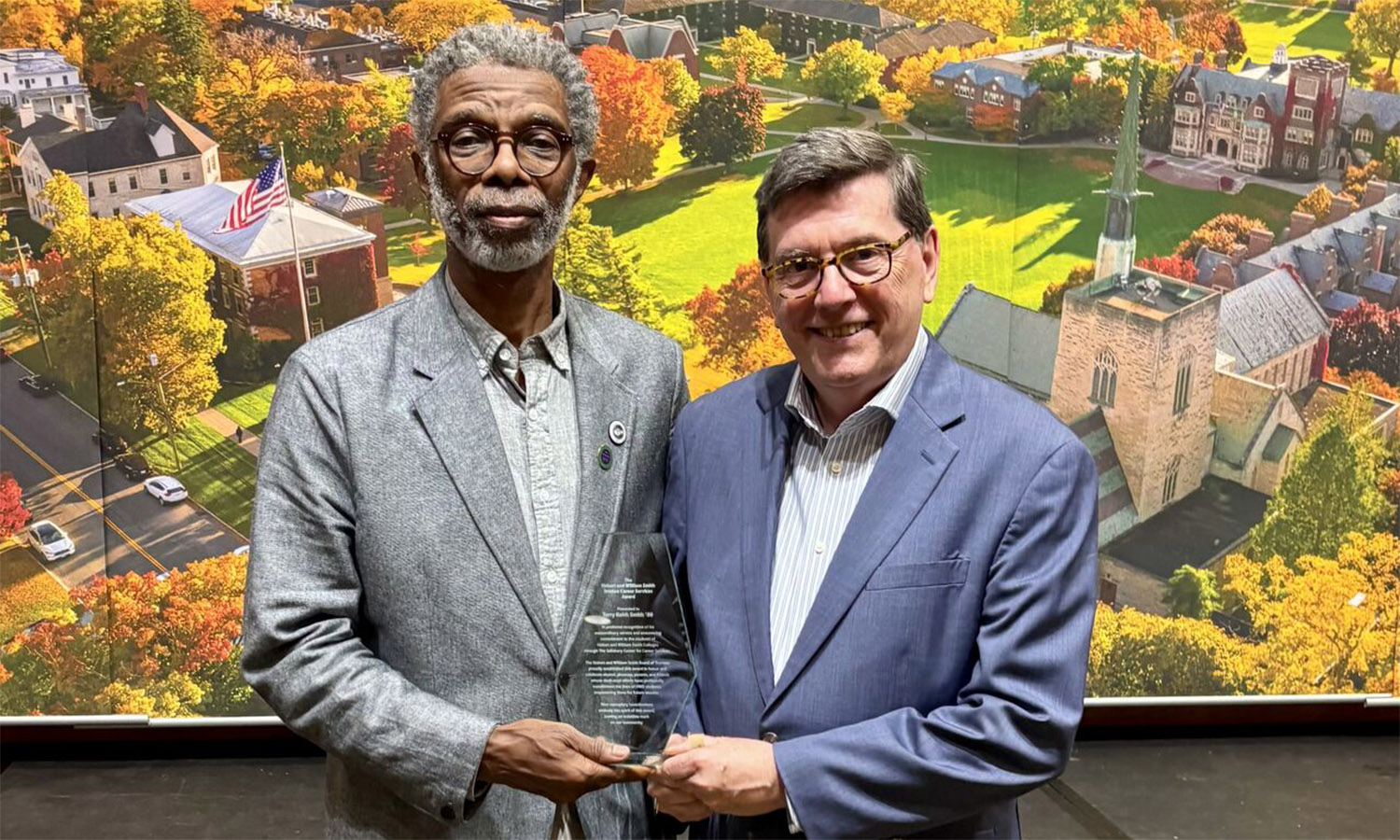 Terry K. Smith '80 poses with President Mark D. Gearan after receiving the HWS Trustees Career Services Award. 