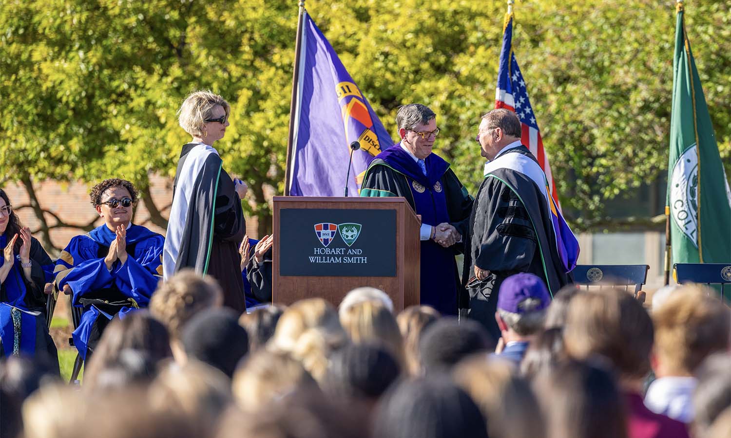 President Mark D. Gearan and Executive Director of Alumni and Alumnae Relations Melanie N. Sage ’95, P’25, P’27 congratulate Richard “Toby” Pugh ’67 on receiving the Hobart Medal of Excellence.