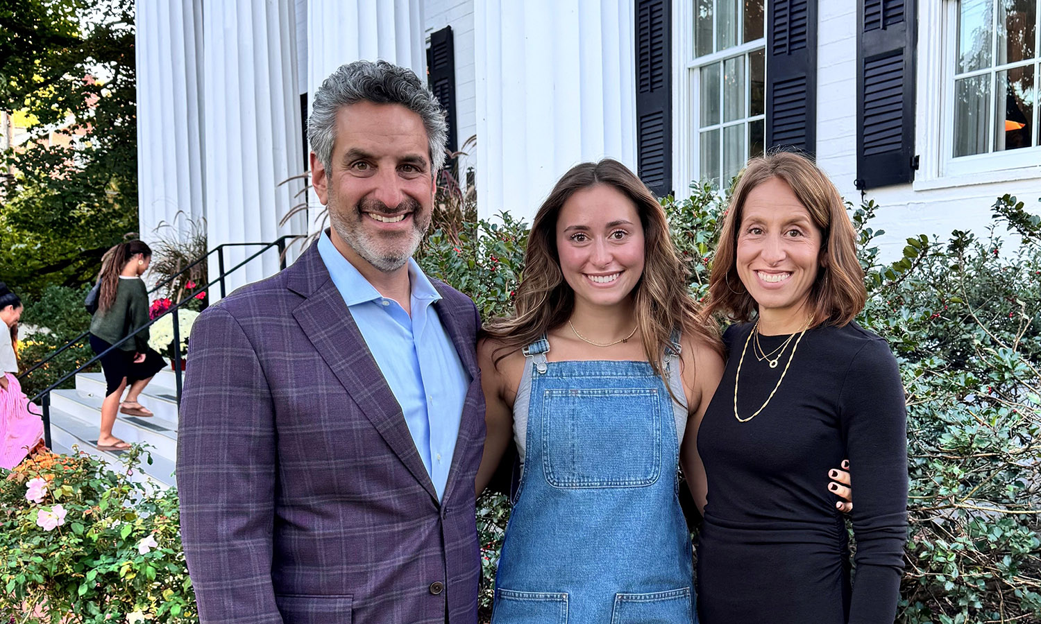 Brian Carp P’27, Sadie Herr '27 and Joanna Carp P’27 have their picture taken together. 