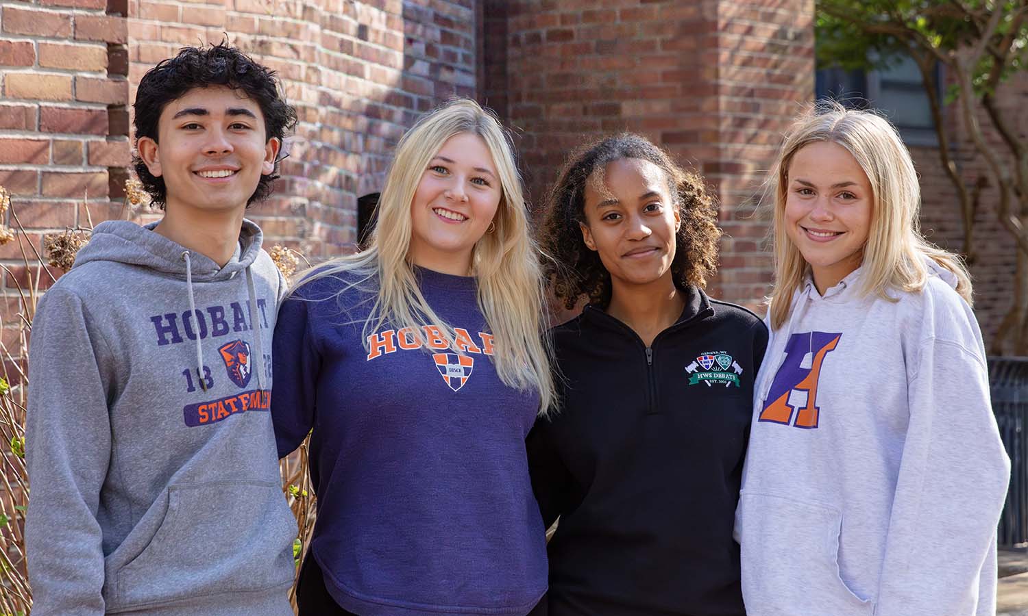 Student leadership team Caio Paiva ’29, Paige Messite ’28, Jasmine Goncalves Piment ’27 and Grace Rund ’27 gather for a photo.