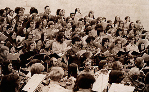 Schola Cantorum and Inter-Faith Choir rehearsing for performance and Nicholas V. D'Angelo, composer and professor, leading the Syracuse Symphony Orchestra augmented by Schola Cantorum of Hobart and William Smith Colleges and Inter-Faith Choir in Bristol Gymnasium on Sunday, April 9, 1972 as part of the Hobart College sesquicentennial celebrations.