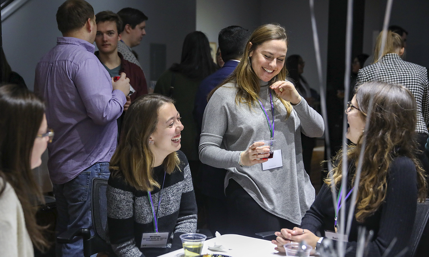 Miranda Smith â19, Assistant Director of Admissions Christine Moloney '17 and Rachel Evans â19 share a laugh during the Young Alum Happy Hour in the Bozzuto Center for Entrepreneruship.