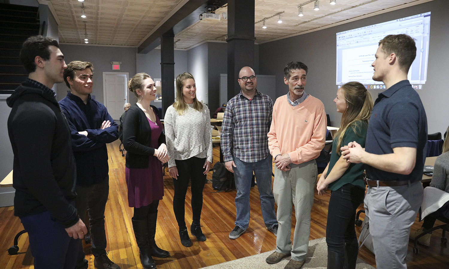 Students talk with Visiting Assistant Professor of Entrepreneurial Studies Craig Talmage and Richard Madia following thier senior capstone course in the Bozzuto Center for Entrepreneurship.