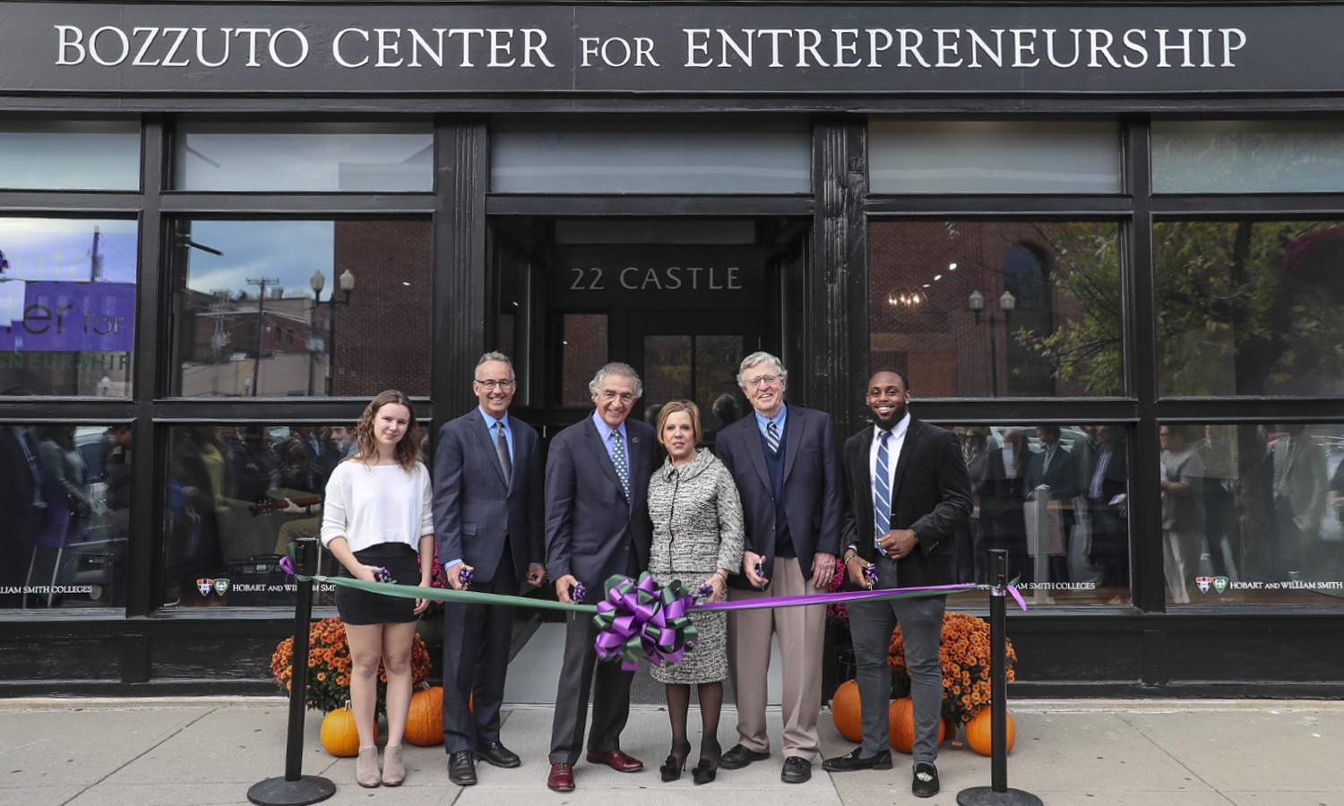 Chloe Elmer '20, Professor of Economics Thomas Drennen, Chair of the Board of Trustees Thomas S. Bozzuto '68 L.H.D. '18, Interim President Patrick A. McGuire L.H.D. '12and Al Smith '19â pose for a photo during the ribbon cutting ceremony as part of the dedication of the new Bozzuto Center for Entrepreneurshipâ in downtown Geneva, N.Y.